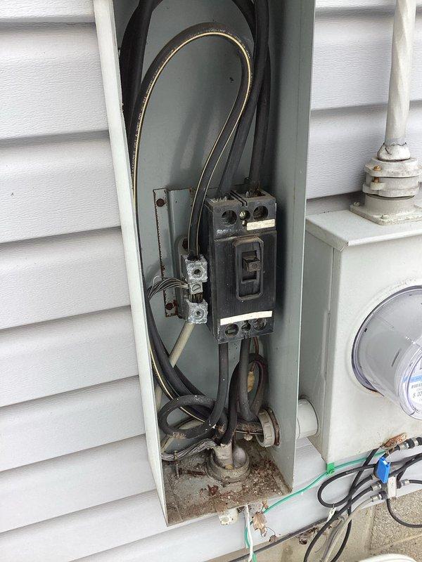 Responded to complete power outage at 40-year-old residence where utility company had identified recurring external breaker trips. Upon inspection, found significant corrosion and debris accumulation in the exterior service panel, along with deteriorated connections. Cleaned panel, replaced corroded components, and secured loose connections to resolve the tripping issue, successfully restoring power and heat to the home.