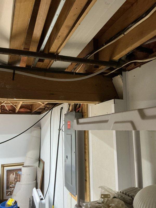 Installed two gas lines and completed disconnect hook-up for a quick connect emergency generator system. Performed work in unfinished basement utility area with proper connection to exterior access point. All installations were completed according to code requirements with successful testing of connections.