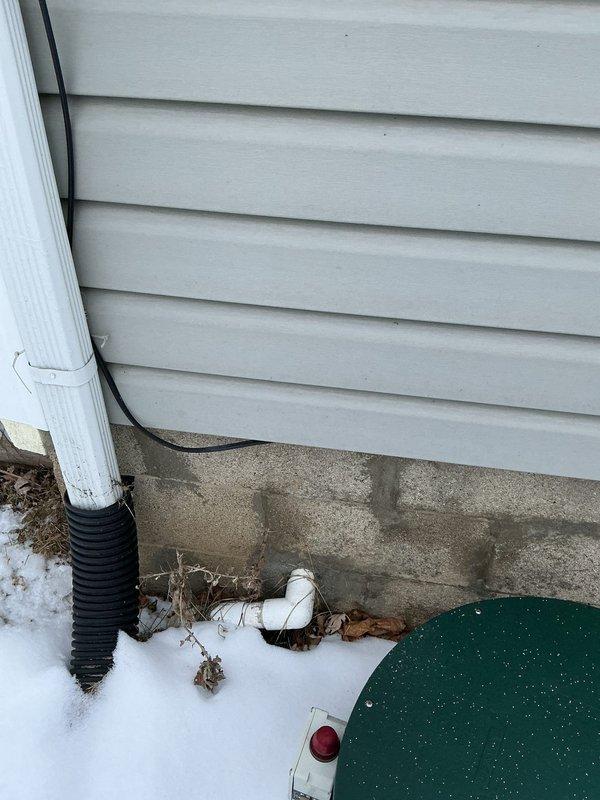 Installed two gas lines and completed disconnect hook-up for a quick connect emergency generator system. Performed work in unfinished basement utility area with proper connection to exterior access point. All installations were completed according to code requirements with successful testing of connections.