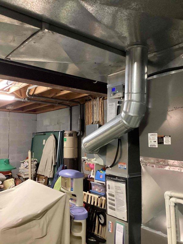 Performed scheduled MVP Heating maintenance visit on residential furnace system. Inspected gray HVAC furnace unit with PVC drainage components and verified proper ductwork connections. Equipment was found in good working condition with no visible issues or anomalies.
