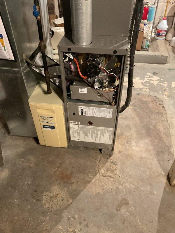 Performed scheduled maintenance on Carrier furnace system with attached Space-Gard humidifier. Completed full inspection of internal components including wiring connections, motor function, and control mechanisms. Used hex key tool to access and service necessary components, ensuring proper operation for the heating season.