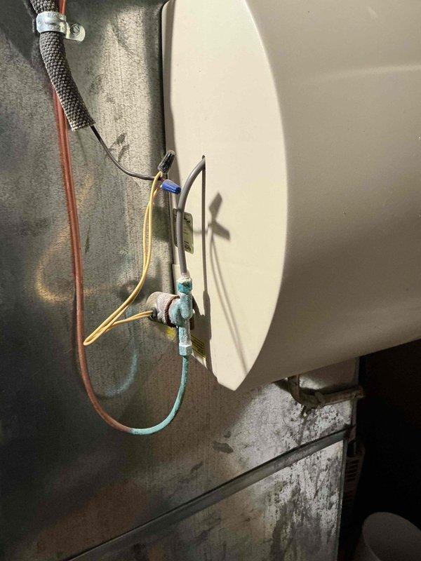 Conducted inspection of 22-year-old furnace with confirmed crack in heat exchanger. Assessment revealed system requires full replacement based on age and safety concerns. Documented condition of existing HVAC system including Rheem water heater and associated ductwork in basement utility area. Customer was left a message to confirm dispatch coordination for replacement.