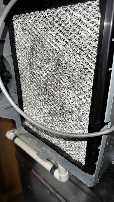 Responded to service call for leaking humidifier. Diagnosed frost buildup on filter mesh, indicating system operating issue. Installed new PCB (Printed Circuit Board) to resolve the problem and restore proper humidifier function.