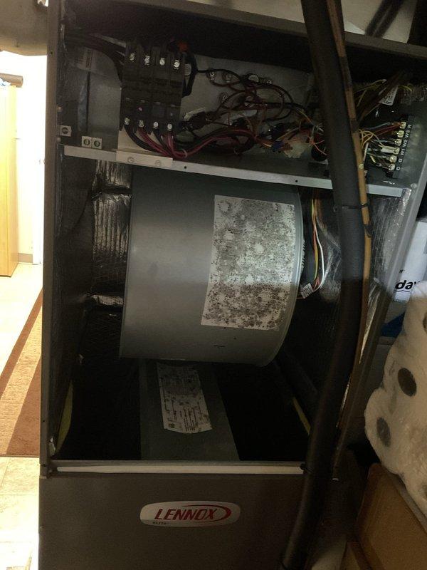 Performed scheduled heating maintenance tune-up on Lennox HVAC system. Inspected blower assembly which showed some dust accumulation and discoloration. Examined cooling coil which appeared darkened, suggesting potential airflow restriction. Evaluated ductwork and recommended professional cleaning to improve system efficiency.
