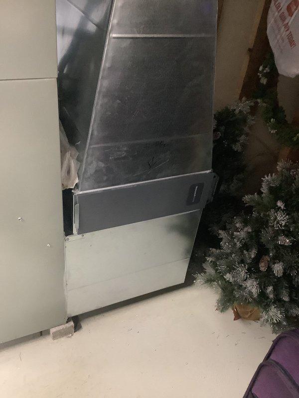 Inspected 14-year-old furnace and identified a cracked heat exchanger, which poses a significant safety hazard. Performed a comprehensive evaluation of the existing HVAC system and provided replacement options with Shea equipment. Documented the current installation configuration in the mechanical room, including ductwork connections and placement relative to other utility equipment.