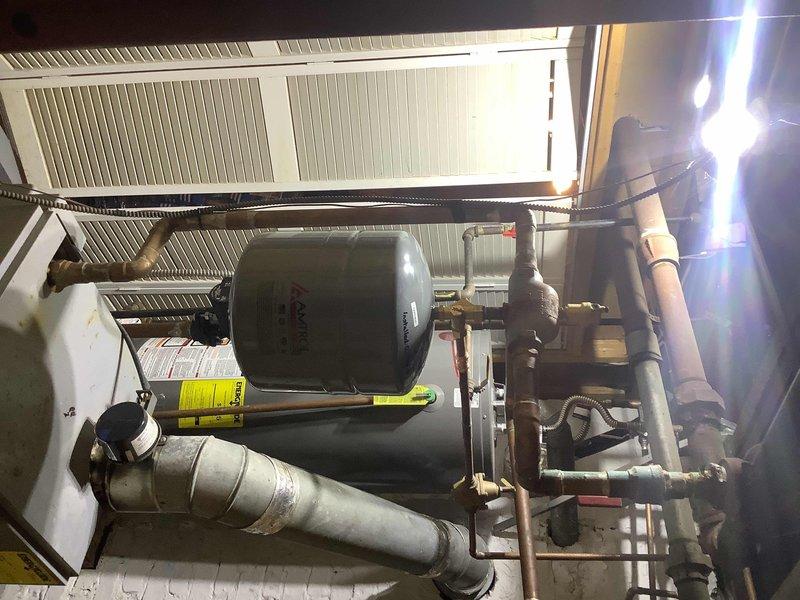 Performed inspection and replacement of a 1/8" air vent at the top of cast iron air separator in heating system. Noted expansion tank has minor leak at Schrader valve which is currently functioning adequately. Ordered necessary replacement parts and placed them in will call for future service.