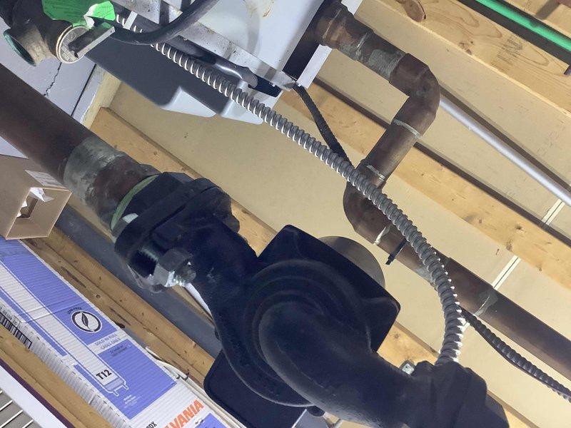 Performed inspection and replacement of a 1/8" air vent at the top of cast iron air separator in heating system. Noted expansion tank has minor leak at Schrader valve which is currently functioning adequately. Ordered necessary replacement parts and placed them in will call for future service.