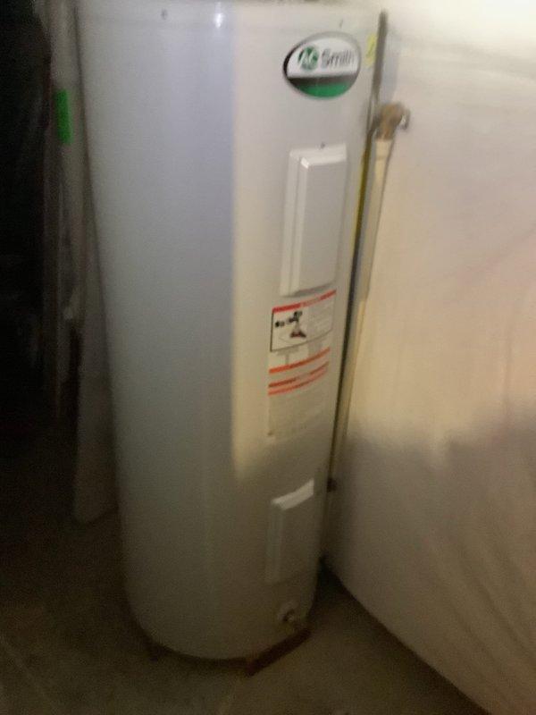 Inspected 13-year-old AO Smith water heater which is not producing hot water and requires frequent resets. Verified electrical connections at panel, confirmed 240V supply to unit. Determined unit has reached end of service life; provided customer with replacement options for new water heater installation.