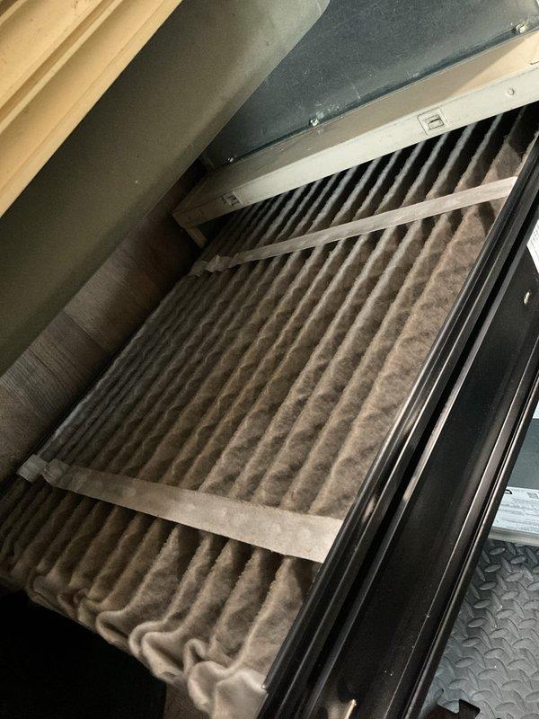 Performed standard furnace tune-up maintenance service. Inspected and evaluated air filter condition, noting moderate dust accumulation on pleated filter media. Used appropriate tools to access and service system components according to manufacturer specifications.