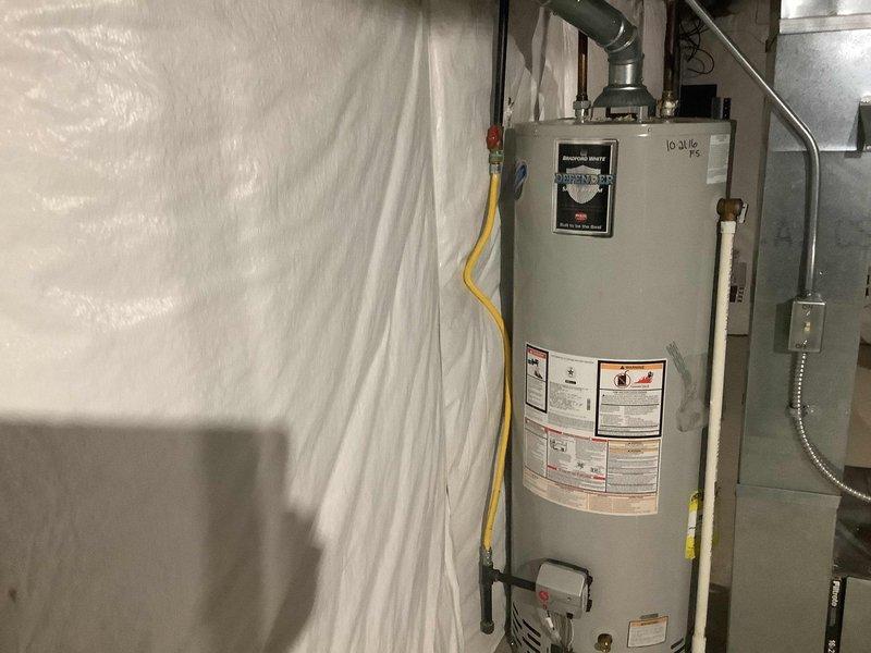 Replaced leaking Bradford White "Defender" water heater in 24-year-old condo with new unit. Completed installation of all necessary connections including gas line, PVC drain piping, and metal vent ducting according to manufacturer specifications and local code requirements.