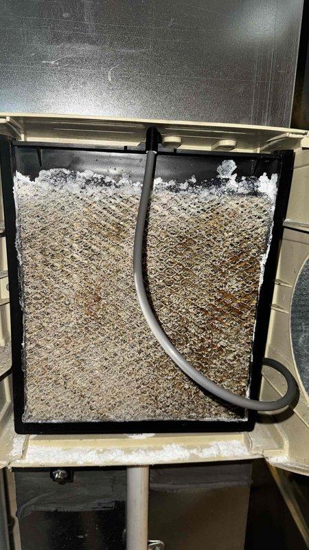 Performed routine maintenance on 8-year-old furnace. Discovered severe frost accumulation on evaporator coil indicating refrigerant flow issues. Multimeter testing confirmed electrical components functioning within normal parameters (132V); cleaned and inspected blower motor assembly and control board connections.