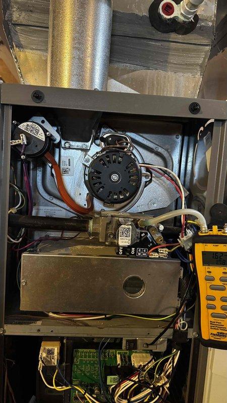 Performed routine maintenance on 8-year-old furnace. Discovered severe frost accumulation on evaporator coil indicating refrigerant flow issues. Multimeter testing confirmed electrical components functioning within normal parameters (132V); cleaned and inspected blower motor assembly and control board connections.