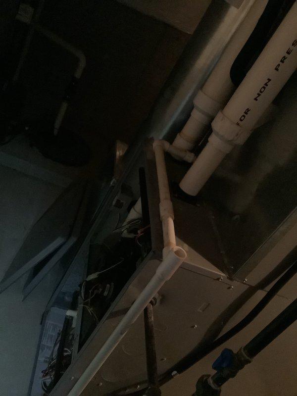 Performed furnace replacement estimate in mechanical room with existing PVC venting system. Assessed current HVAC unit and black insulated ductwork. Documented condition of connections and surrounding utility infrastructure with photos for comprehensive replacement proposal.