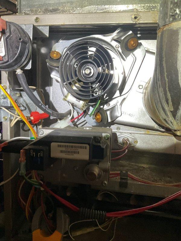 Responded to no-heat call at residential property. Upon inspection, found faulty blower motor assembly causing system failure. Replaced motor, verified proper electrical connections (600V) to control board, and tested system operation. Unit now functioning correctly with proper airflow.