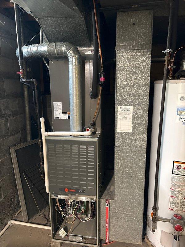 Successfully installed a new furnace with 90-degree ductwork in customer's utility room/basement. System includes proper ventilation connections and drainage piping. Installed and tested Kidde carbon monoxide detector to ensure safety compliance.