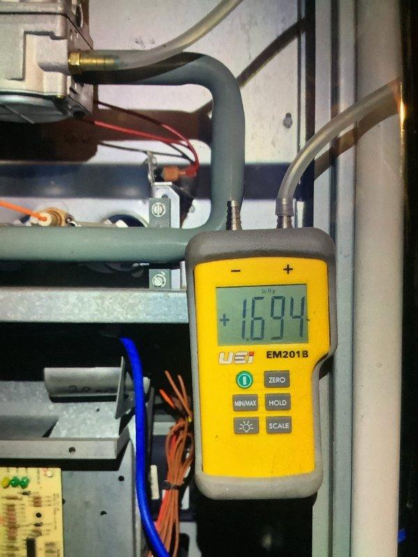 Performed scheduled MVP furnace maintenance service. Conducted static pressure testing with EM201B digital manometer (reading: 1694), and inspected filter condition. Pleated filter appears functional with normal accumulation of debris.