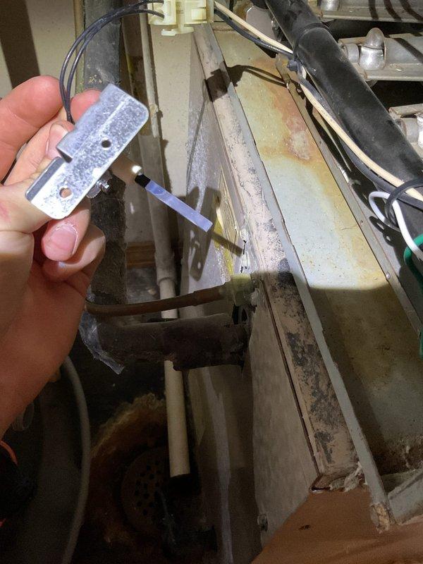 Performed scheduled furnace tune-up service. Conducted diagnostic testing using specialized sensor equipment to assess system functionality. Inspected internal components, noting some age-related wear and surface oxidation on metal panels. Utilized precision tools to complete required maintenance procedures. System was returned to proper operating condition following manufacturer specifications.