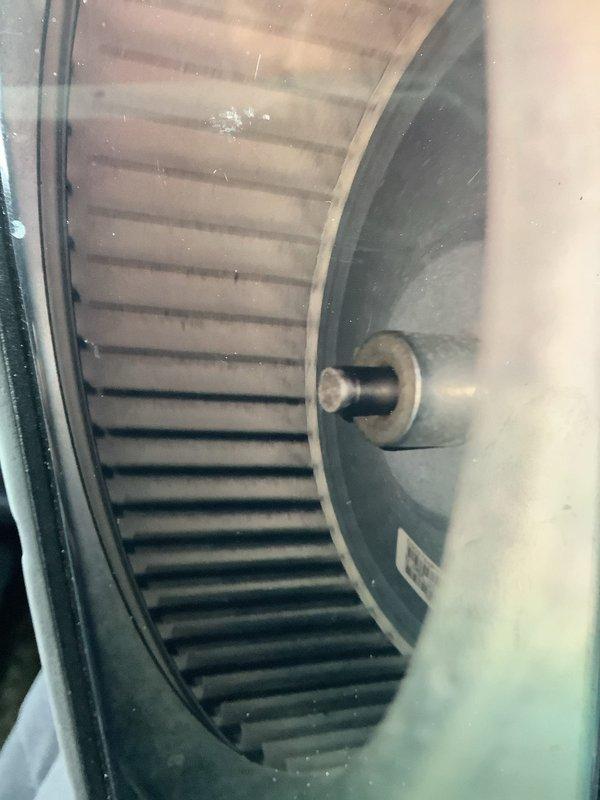 Performed diagnostic service on 23-year-old residential furnace that was non-operational. Inspection revealed accumulated dust on blower wheel and examined electrical connections at control board where multiple wires (red, yellow, blue, white, green) were properly terminated. Cleaned components and restored system to working condition.