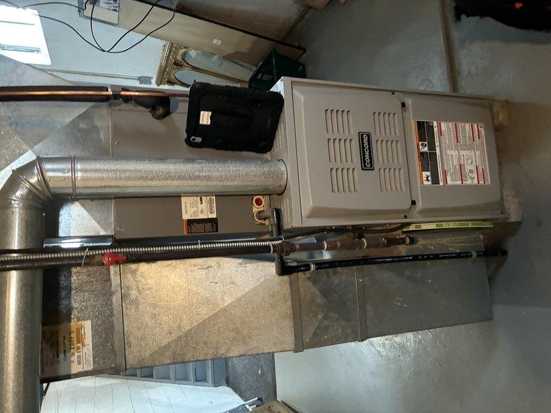 Serviced a Goodman natural gas furnace reporting no heat. Upon inspection of the aging unit, identified faulty control board connections and misaligned blower motor as root causes. Repaired electrical connections, realigned blower assembly, and verified proper heating operation through complete system test.