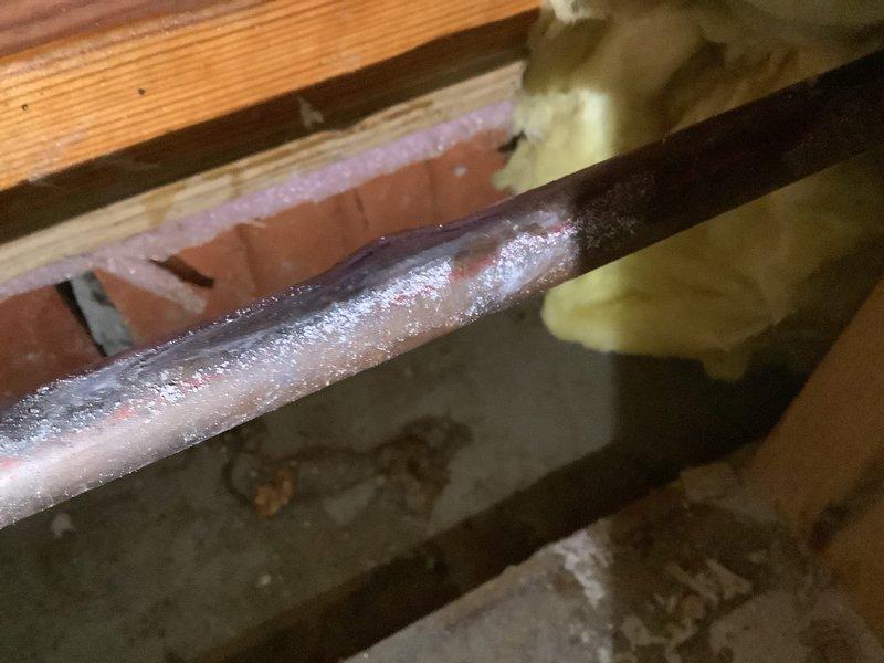 Accessed wall cavity to diagnose and repair a burst copper water line. Located frost-covered pipe within structural framing, opened drywall for proper access, and completed necessary repairs. Parts were ordered and received for the repair work as specified.