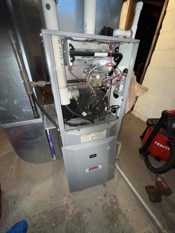 Performed scheduled MVP maintenance service on 22-year-old furnace. Removed front panel to inspect internal components including blower motor, circuit board, and wiring. Cleaned system and checked all connections, noting minor corrosion on heat exchanger components that remain functional.