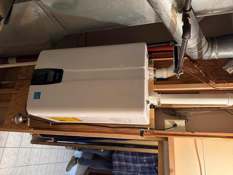Performed scheduled maintenance on customer's tankless water heater system. Inspected all connections and fittings for proper operation, including copper supply lines, pressure regulator, and expansion tank. Confirmed Energy Star unit was functioning correctly with no leaks or anomalies detected in the basement installation.