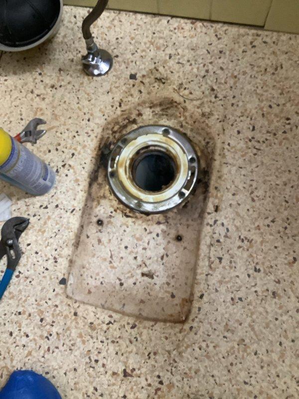 Completed installation of new American Standard Champion toilet (comfort height, elongated bowl, 1.6 GPF) as quoted. Removed old toilet showing significant floor staining and drain discoloration. Properly sealed new unit to floor with appropriate caulking to prevent future water damage.