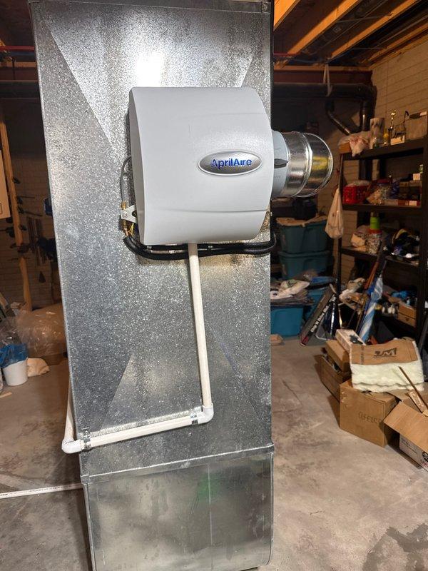 Successfully installed an AprilAire 600 humidifier system on the existing HVAC unit in an unfinished basement area. Mounted the humidifier housing to the ductwork, connected water supply lines with appropriate valves, and ensured proper integration with the existing ventilation system. All connections were secured and system functionality was verified upon completion.