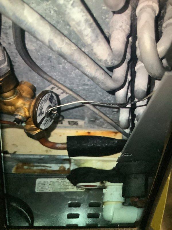 Performed scheduled MVP Heating maintenance service on 5-year-old system (rescheduled from previous dates). Conducted comprehensive system inspection including refrigerant line assessment and pressure testing. Performed electrical diagnostics with EM2018 meter showing 186V reading at blower motor assembly, confirming proper voltage supply to unit.