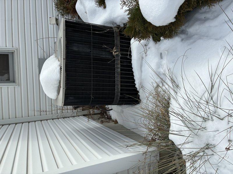 Responded to service call for 16-year-old furnace exhibiting premature burner shutoff and alternating diagnostic lights. Performed visual inspection of heat exchanger using inspection camera, revealing signs of wear and possible mineral deposits. Exterior inspection of connected heat pump system showed normal winter conditions with adequate clearance despite snow accumulation.