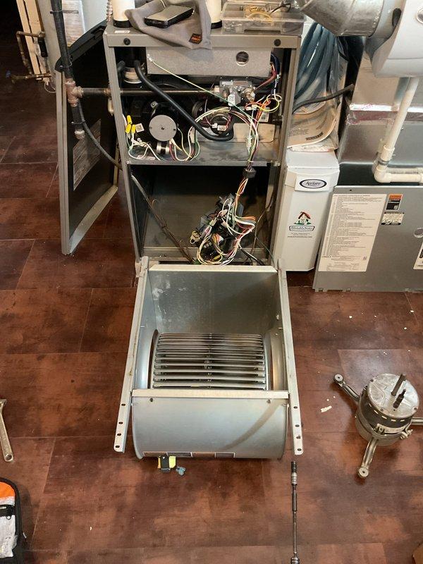 Successfully replaced defective blower motor and wheel in Lennox furnace as part of warranty service. Installed all components properly, ensuring correct electrical connections and secure mounting in the basement HVAC system that includes an Aprilaire humidifier.