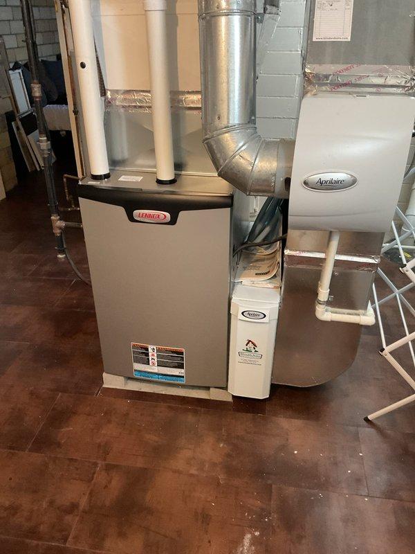Successfully replaced defective blower motor and wheel in Lennox furnace as part of warranty service. Installed all components properly, ensuring correct electrical connections and secure mounting in the basement HVAC system that includes an Aprilaire humidifier.