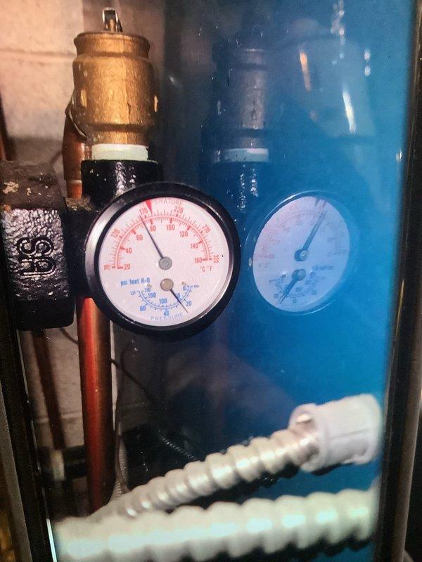 Performed scheduled maintenance on boiler system. Identified and tightened leaking brass union on top of boiler to stop dripping. Inspected pressure gauges and copper piping network, confirming proper system operation post-repair.