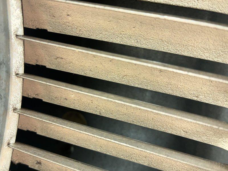 Performed routine maintenance on 3-year-old gas furnace (MVP model). Inspected and documented condition of air filter showing significant dust accumulation requiring replacement. Examined ventilation components including grille assembly which displayed minor dust buildup on horizontal slats.