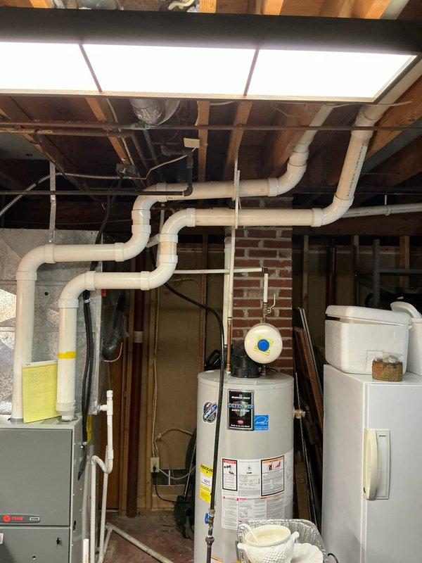 Conducted furnace replacement estimate on 11-year-old system. Documented existing HVAC setup in unfinished basement, including connections to water heater and complex PVC ventilation system. Note: Driveway access limited due to snow accumulation; future technicians advised to park at top to avoid getting stuck.