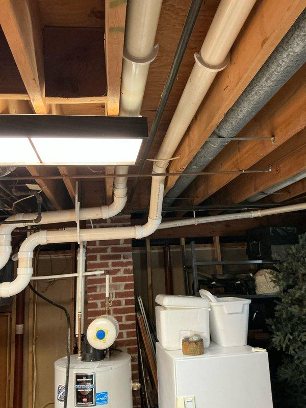 Conducted furnace replacement estimate on 11-year-old system. Documented existing HVAC setup in unfinished basement, including connections to water heater and complex PVC ventilation system. Note: Driveway access limited due to snow accumulation; future technicians advised to park at top to avoid getting stuck.