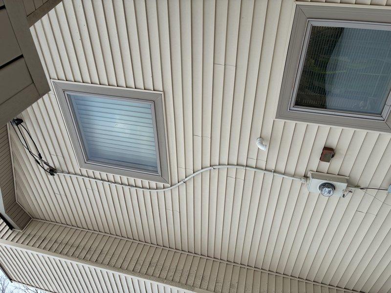 Assessed client's request to convert 220V stove line to 110V service. After inspection, determined conversion was not recommended per NEC guidelines. Documented existing installation with photos showing exterior conduit routing and interior electrical connections. No modifications were performed.