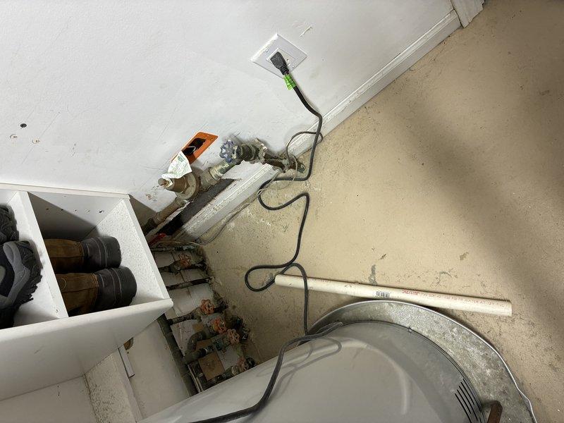 Assessed client's request to convert 220V stove line to 110V service. After inspection, determined conversion was not recommended per NEC guidelines. Documented existing installation with photos showing exterior conduit routing and interior electrical connections. No modifications were performed.