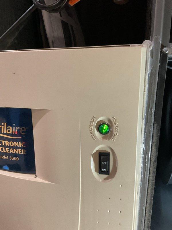 Performed scheduled furnace preventative maintenance service. Inspected Frigidaire Electronic Air Cleaner Model 5000, confirmed unit powered on with green indicator light illuminated. Examined filter mesh system and verified proper installation with no visible damage.