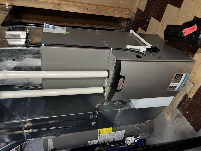 Performed routine heating maintenance on a 1-year-old system. Inspected furnace installation and connection points, noting system appears to be in good working condition. Identified severely dirty air filter with significant dust and particulate buildup requiring immediate replacement.