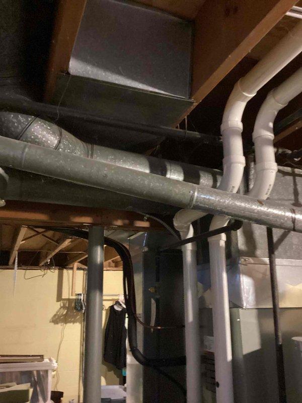 Performed scheduled MVP heating maintenance visit on residential HVAC system. Inspected furnace unit, associated ductwork, and PVC exhaust/intake piping in basement utility area. All components were found to be in proper working condition with no issues identified.
