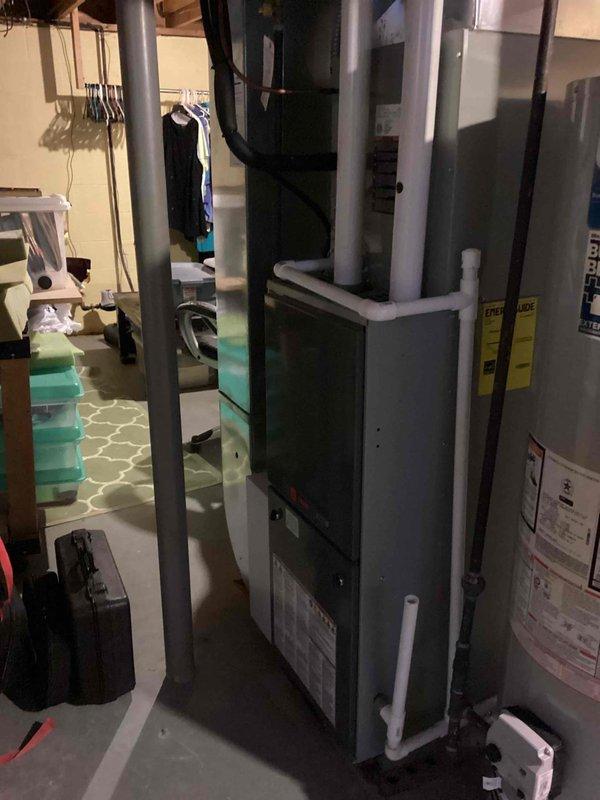 Performed scheduled MVP heating maintenance visit on residential HVAC system. Inspected furnace unit, associated ductwork, and PVC exhaust/intake piping in basement utility area. All components were found to be in proper working condition with no issues identified.