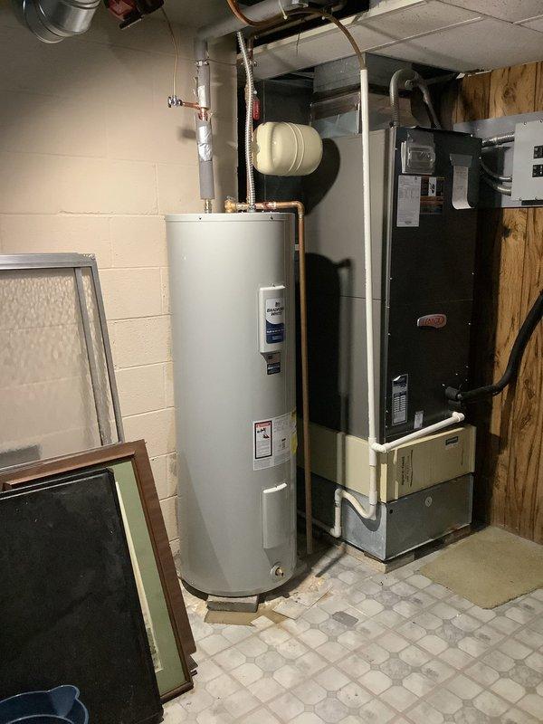 Successfully replaced customer's 80-gallon electric water heater with a new 50-gallon Bradford White model. Installation included new water shut-off valve, expansion tank, and a 1/2" x 1/4" shut-off valve for the humidifier. System was properly connected to existing plumbing with copper piping and comes with an 8-year warranty.