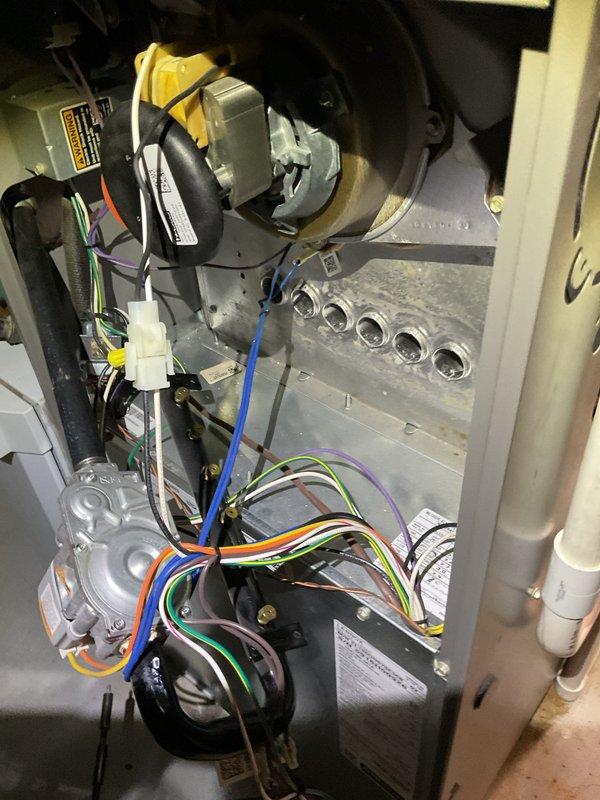 Responded to no-heat complaint for furnace showing intermittent operation. Upon inspection, identified loose electrical connections at the blower motor and control board. Cleaned dust accumulation from internal components, secured all wiring connections, and verified proper electrical continuity. System now functioning properly with consistent operation.