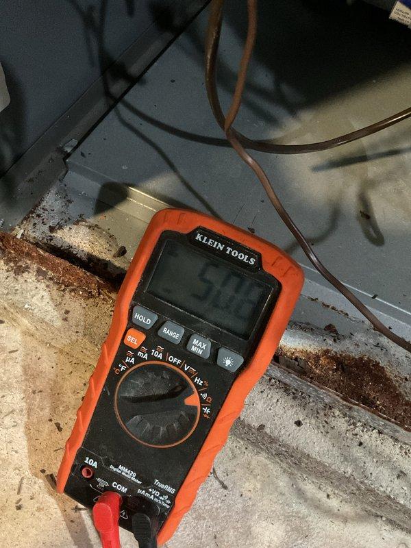 Performed scheduled furnace tune-up service as confirmed. Conducted electrical testing with multimeter showing 502 ohms reading on component. Discovered damaged/corroded mesh screen in heating system which was inspected and documented.