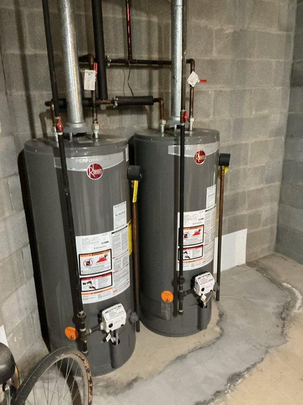 Successfully replaced two 2014 40-gallon short water heaters with new Bradford White units featuring 6-year manufacturer warranties. Work included replacing ball valves, rebuilding water lines to accommodate the new tanks, and installing thermal expansion tanks for each unit. Customer received a one-year maintenance value plan with all associated benefits and discounts.