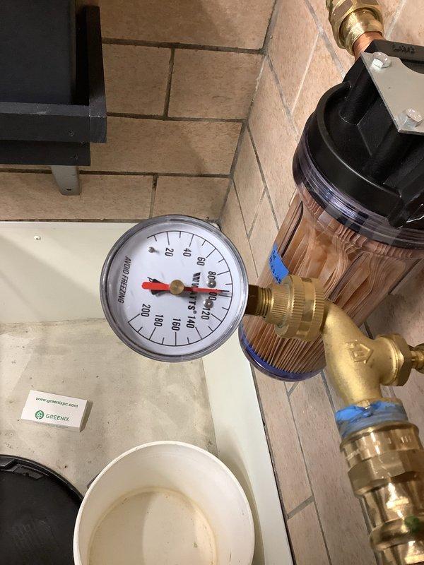 Responded to service call for a 4-month-old hot water tank leaking from the relief valve. Inspected system and confirmed overflow valve malfunction. Replaced faulty temperature and pressure relief valve, tested water pressure (verified within normal operating range), and confirmed proper system operation with no further leaks.