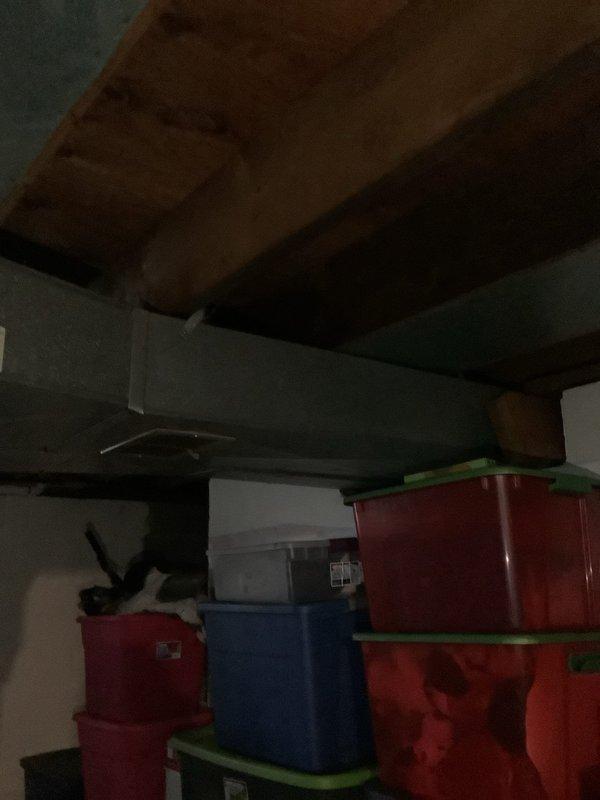 Conducted service call to evaluate basement area for installation of new lighting fixtures and outlets. Inspected existing electrical infrastructure in unfinished basement with exposed joists and beams. Assessed optimal placement locations for new outlets and fixtures around water heater and storage areas to improve functionality and safety in the dimly lit space.