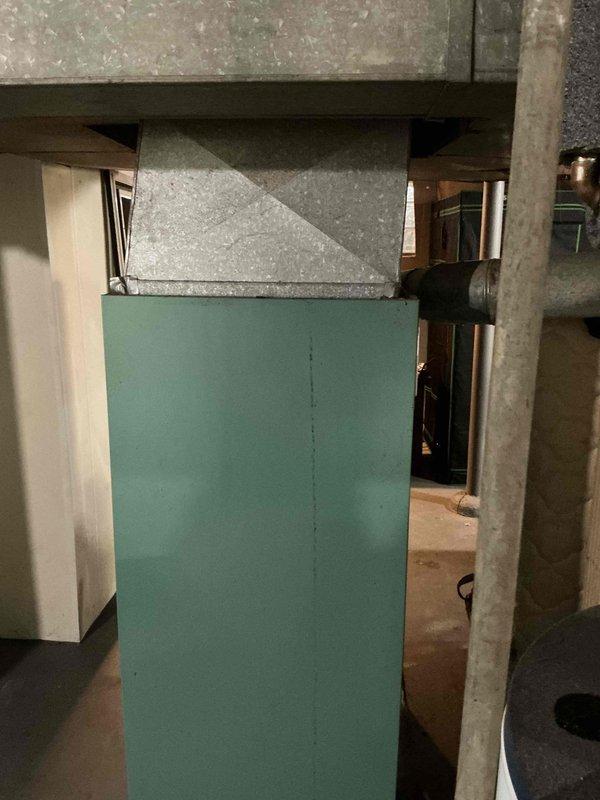 Completed removal of existing 80% efficiency lowboy furnace and air conditioning unit. Installed new mint green furnace with proper ductwork connections in basement utility area. All old equipment was hauled away from the property. System installation verified complete with proper connections to existing ductwork.