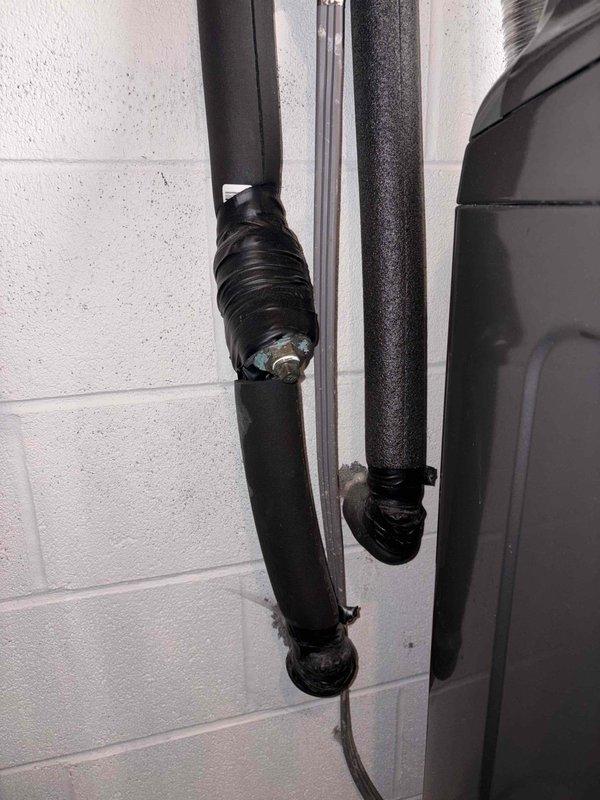 Attended property for scheduled combi boiler appointment. Inspected and serviced HVAC system pipes, ensuring proper insulation and connection integrity on the black insulated vertical pipes. Identified and secured a connection point that required additional wrapping with insulation material. Verified all mounting brackets were properly secured to the concrete block wall.